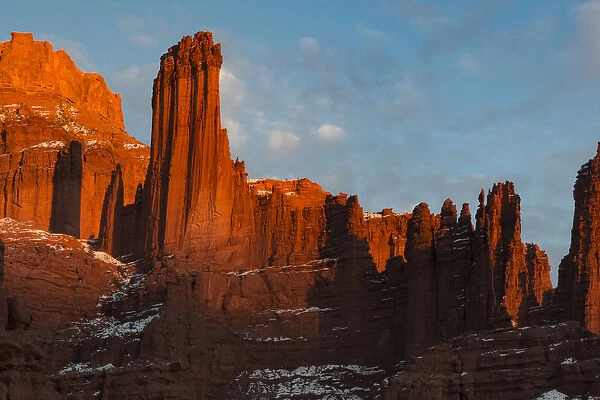North America, USA, Utah. Fisher Towers with snow and clouds, near Castle Valley, Utah