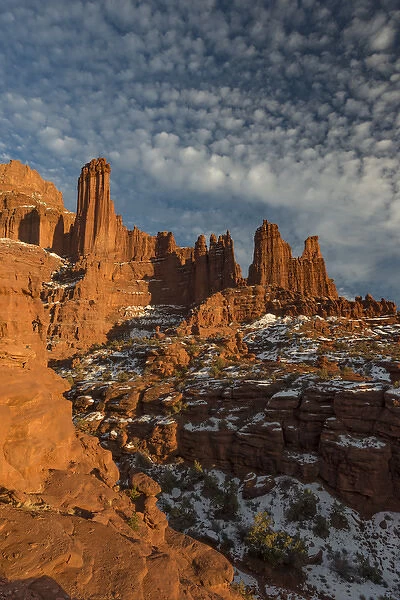 North America, USA, Utah. Fisher Towers with snow and clouds, near Castle Valley, Utah
