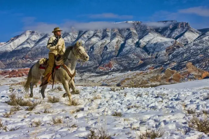Framed Print : North America; USA; Wyoming; Shell; Cowboy riding Horse through the Snow; Model Released Framed Print : North America; USA; Wyoming; Shell; Cowboy riding Horse through the Snow; Model Released