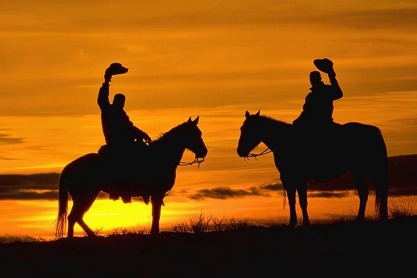North America; USA; Wyoming; Shell; Cowboys on ridge at Sunset; (MR)
