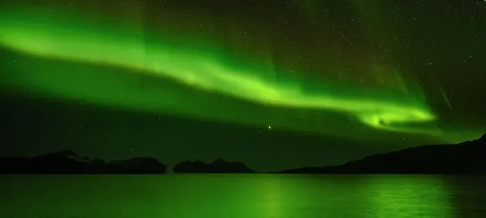 Framed Print : Northern Lights over Angmagssalik Fjord near settlement Kuummiit (formerly spelled Kummiut). Ammassalik area in East Greenland, Danish Territory
