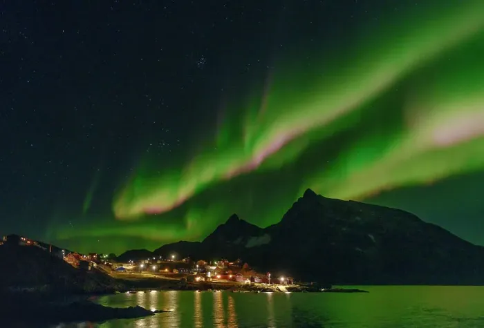 Framed Print : Northern Lights over settlement Kuummiit (formerly spelled Kummiut). Ammassalik area in East Greenland, Danish Territory