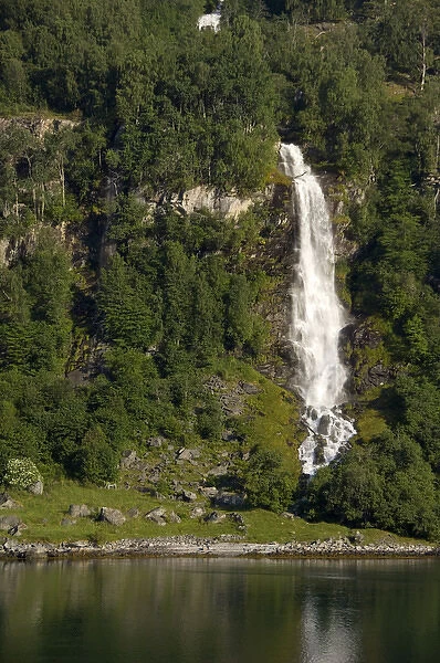 Norway, Geirangerfjord. View of waterfall in scenic fjord sailing toward Hellesylt & Geiranger
