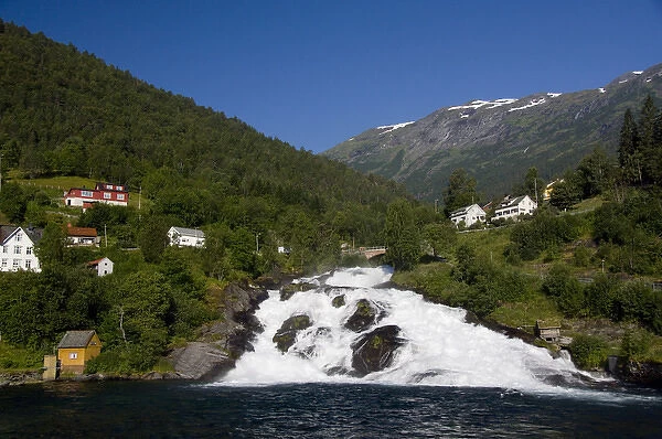 Norway, Hellesylt. Waterfall that spills into Geirangerfjord at the port city of