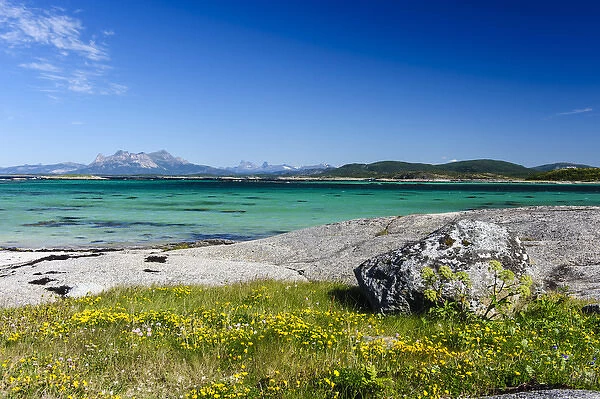 Norway, Nordland. Glacially polished rock slabs mixes with sandy beaches along Vestfjorden