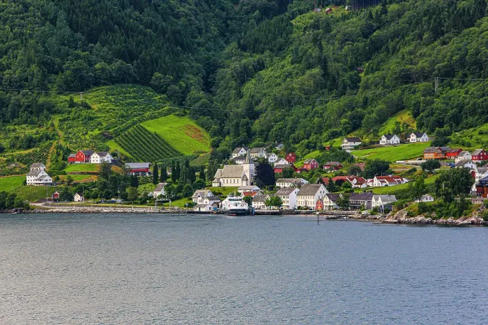 Framed Print : Norway, Norwegian Fjords. Seaside village, church, red barns Framed Print : Norway, Norwegian Fjords. Seaside village, church, red barns