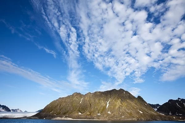 Norway, Svalbard, Clouds above steep cliffs along Spitsbergen Island in Albert I