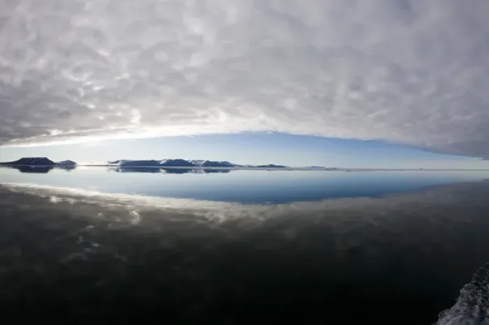 Framed Print : Norway, Svalbard, Edgeoya Island, Reflection of low clouds in calm sea on summer