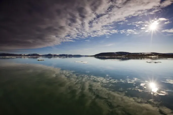 Framed Print : Norway, Svalbard, Edgeoya Island, Reflection of low clouds in calm sea on summer