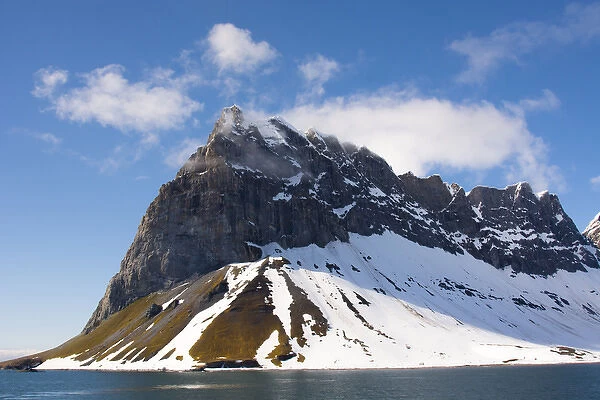Norway. Svalbard. Hornsund. Dramatic cliffs tower over the sound