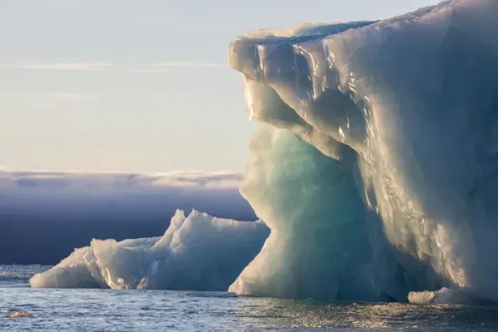 Framed Print : Norway, Svalbard, Kvitoya. Iceberg and fog bank at sunrise