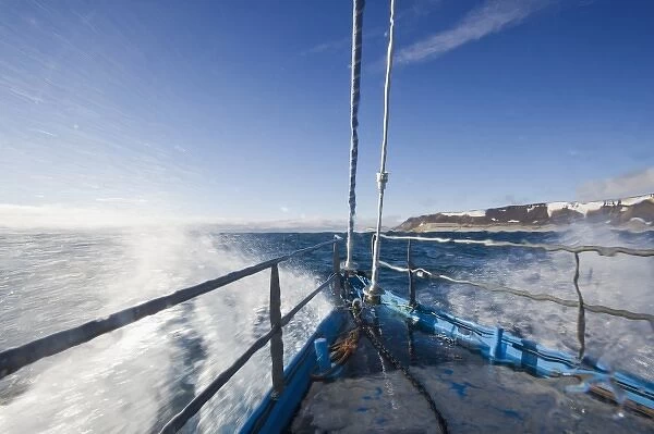 Norway, Svalbard, Nordaustlandet, Yacht SV Arctica sailing through heavy seas in
