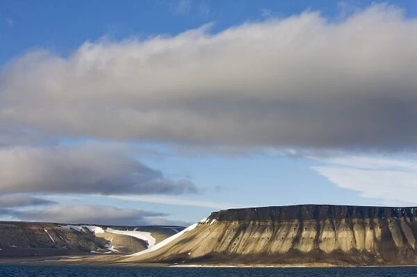 Norway, Svalbard, Nordaustlandet, Storm clouds rolling over mountains along Wahlenbergfjorden
