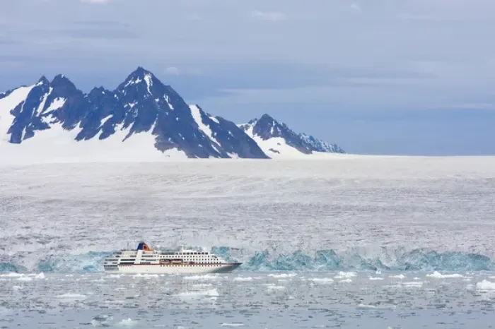 Framed Print : Norway, Svalbard, Spitsbergen, Cruise Ship MV Columbus motoring past blue ice face