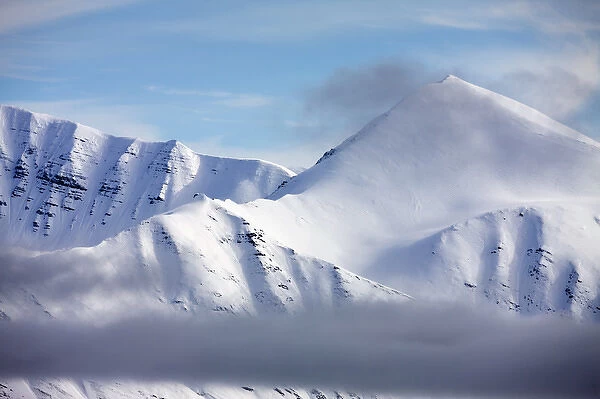 Norway, Svalbard, Spitsbergen Island, Clearing summer snow storm above mountain