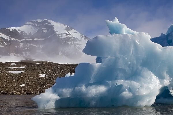 Norway, Svalbard, Spitsbergen Island, Melting iceberg floating in Burgerbukta Bay