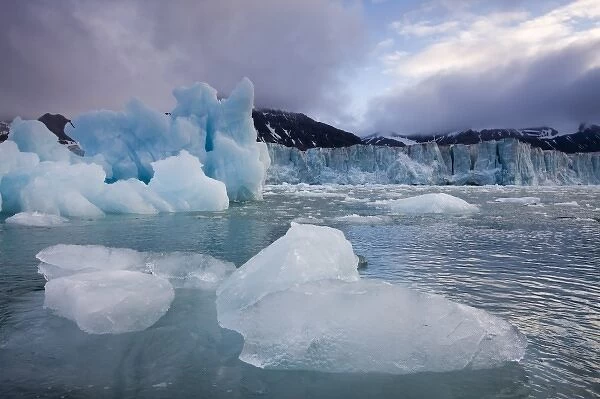 Norway, Svalbard, Spitsbergen Island, Deep blue icebergs floating near face of Sveabreen