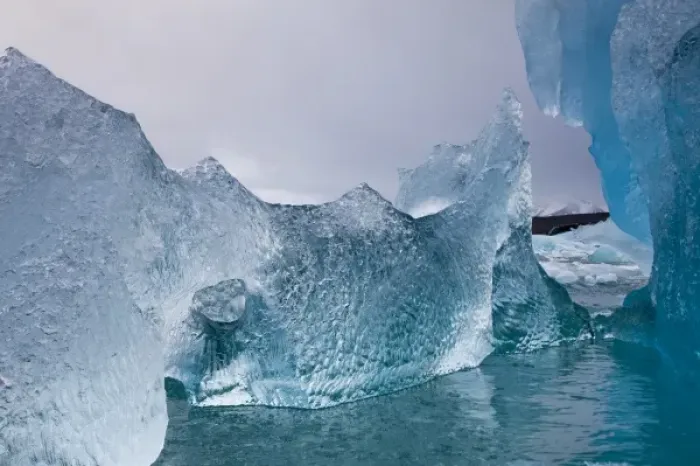 Framed Print : Norway, Svalbard, Spitsbergen Island, Deep blue icebergs floating near face of Sveabreen