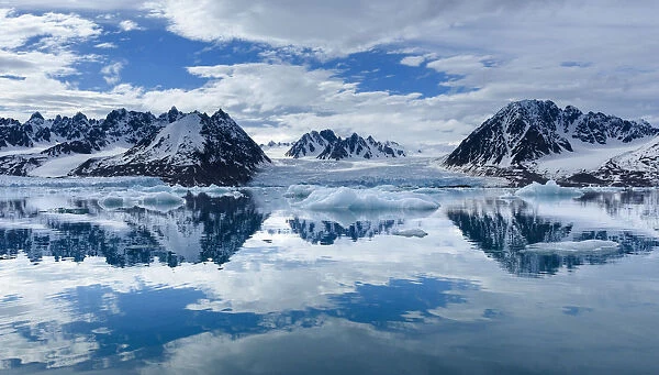 Norway, Svalbard, Spitsbergen. Monacobreen Glacier and mountain reflections