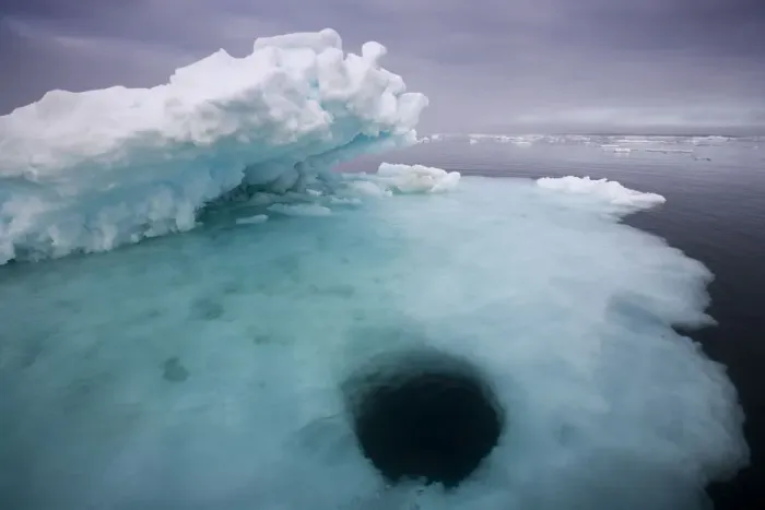 Framed Print : Norway, Svalbard, Storfjorden Fjord, Hole melting in iceberg floating on summer evening