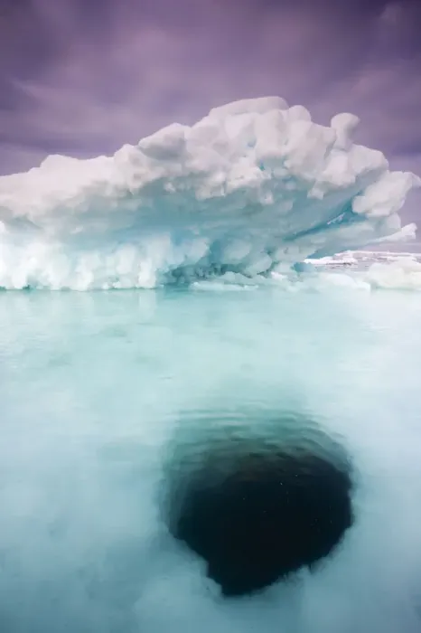 Framed Print : Norway, Svalbard, Storfjorden Fjord, Hole melting in iceberg floating on summer evening