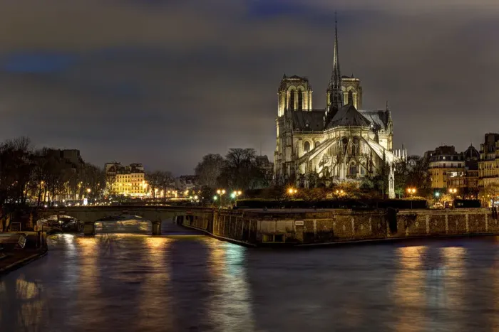 Framed Print : Notre Dame Cathedral and the Seine River shimmer in the Paris, France. night