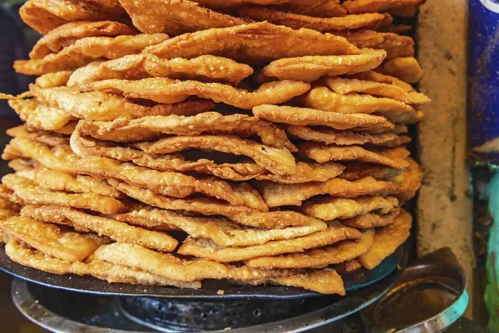 Framed Print : Nowhatta, Srinagar, Jammu and Kashmir, India. Fried snack food at a market in Srinagar
