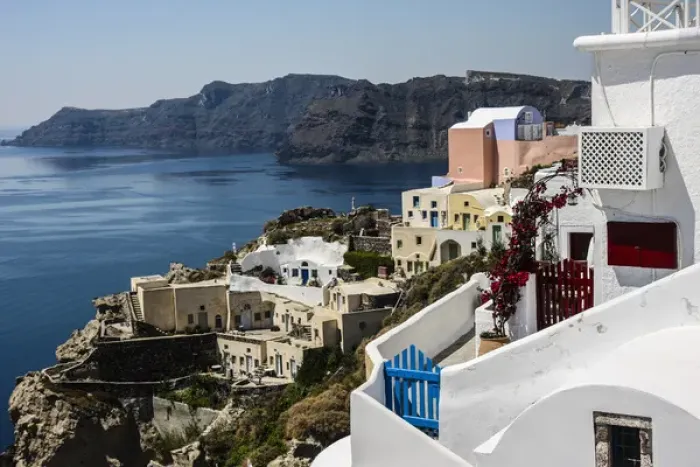 Framed Print : Oia, Santorini, Greece. Village of Oia with blue and red wooden gates and painted Framed Print : Oia, Santorini, Greece. Village of Oia with blue and red wooden gates and painted