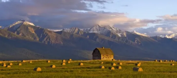 Framed Print : Old barn framed by hay bales and dramatic Mission Mountain Range in Montana Framed Print : Old barn framed by hay bales and dramatic Mission Mountain Range in Montana