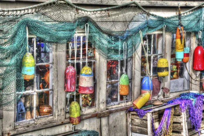 Framed Print : Old building, Netarts, Oregon. Decorated with colorful fishing gear Framed Print : Old building, Netarts, Oregon. Decorated with colorful fishing gear