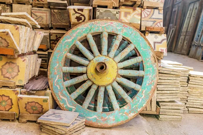 Framed Print : Old Cairo, Cairo, Egypt. Wooden cart wheel and floor tiles in an alley in Cairo