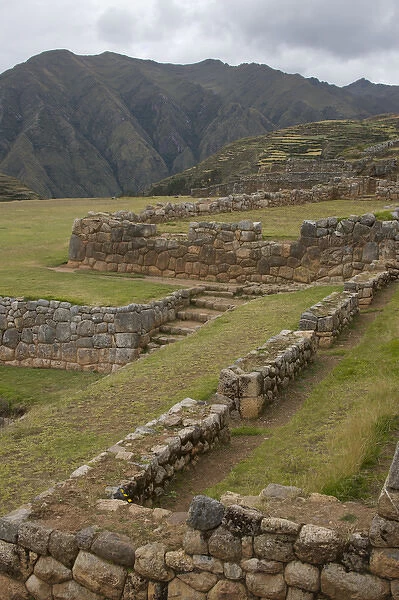 Old Inca walls surround field with mountain in distance, Chinchero (near Cuzco), Peru