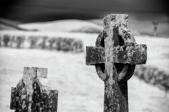 Framed Print : Old lichen-covered Celtic cross has been here for many years at Burrishoole Abbey in County Mayo, Ireland