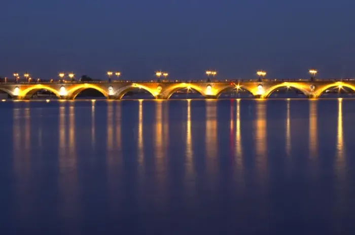 Framed Print : The old Pont de Pierre bridgeat night with reflections in Bordeaux on the Garonne River Framed Print : The old Pont de Pierre bridgeat night with reflections in Bordeaux on the Garonne River