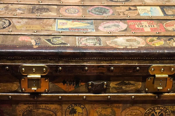 Old steamer trunk covered with stickers of various destinations