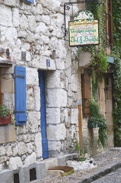 Old stone houses, sign saying Le Colombier de Grando and Roxane Bed and Breakfast