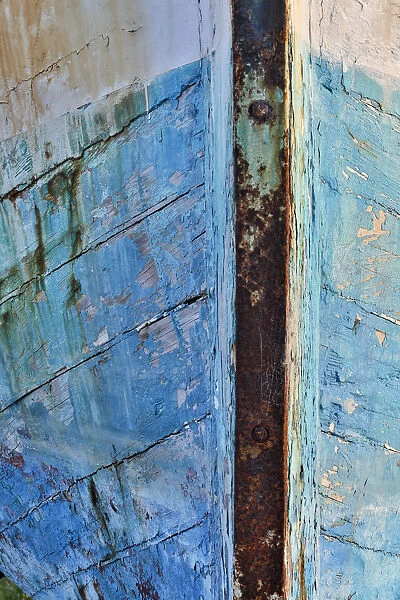 Old wooden fishing boat out of water, detail of paint. Crescent City, California