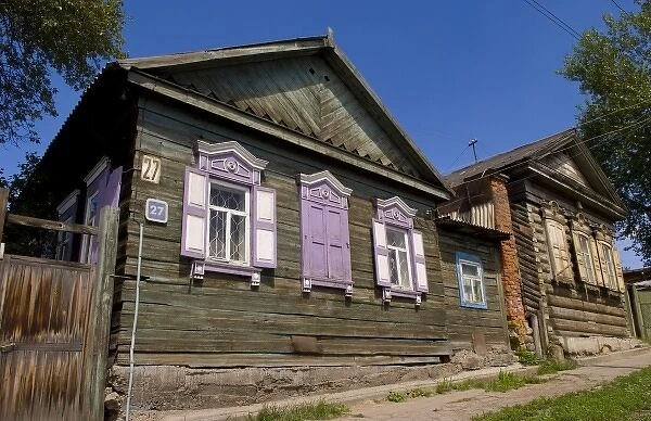 Old wooden worn house with colorful shutters in Irkutsk in Siberia Russia