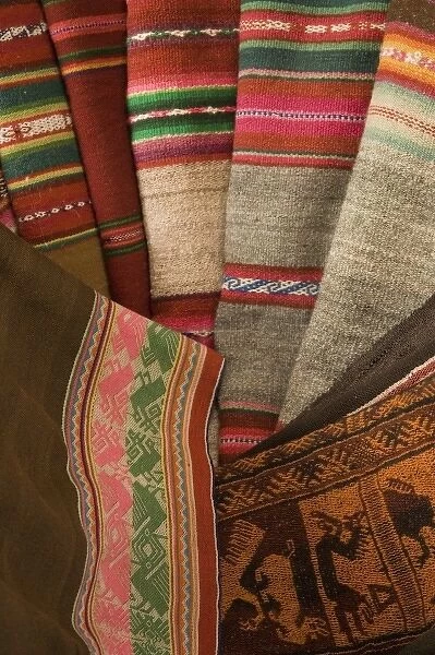 Old woven textile on display in shop, Lima, Peru