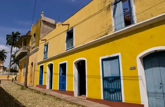 Framed Print : Old yellow building in colonial town of Trinidad Cuba