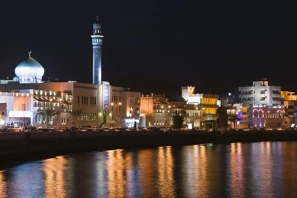 Oman, Muscat, Mutrah. Mutrah Corniche Buildings  /  Evening