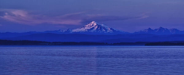 Orcas Island, USA - Mt. Baker and the Cascade Range backdrop the Puget Sound at dusk