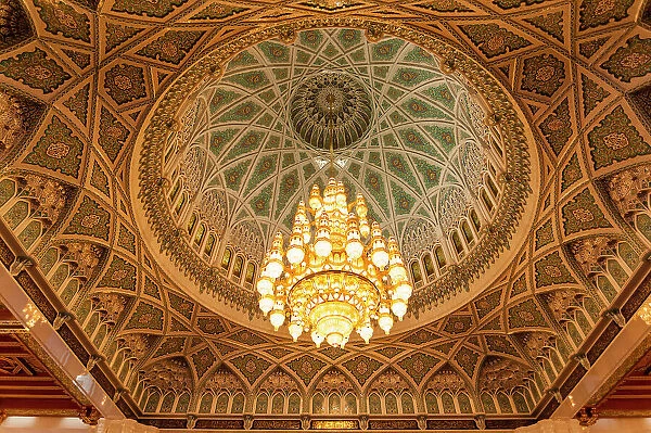 An ornate ceiling in the men's prayer room of the Sultan Qaboos Grand Mosque, Muscat, Oman