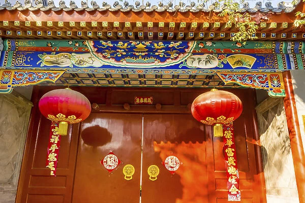Ornate red door, lanterns New Year sayings, Hutong Neighborhood, Beijing, China