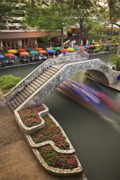 Framed Print : Outdoor cafe along River Walk and boat in motion passing under bridge over San Antonio River Framed Print : Outdoor cafe along River Walk and boat in motion passing under bridge over San Antonio River