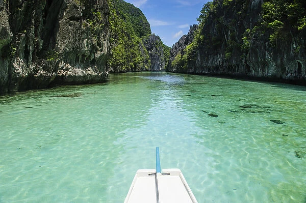 Front of an outrigger boat in the crystal clear water in the Bacuit archipelago, Palawan