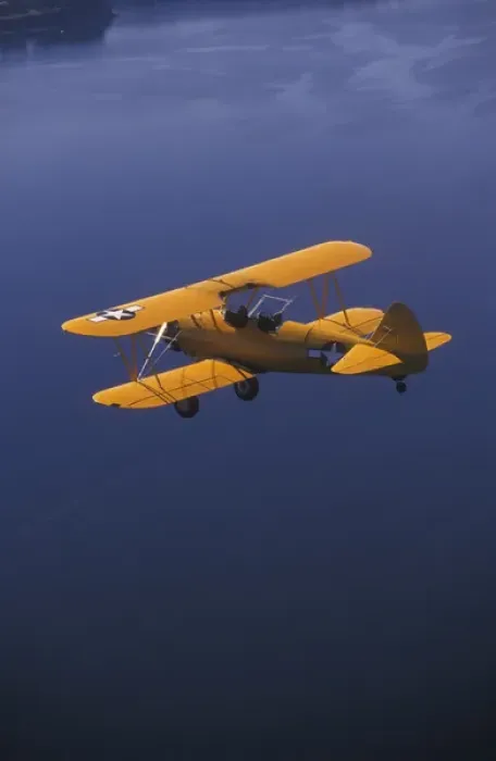Framed Print : P. R. Yellow Biplane, 1944 Stearman PT-17, flying over Puget Sound, WA