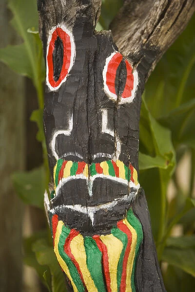 Painted face on driftwood, Placencia, Stann Creek District, Belize, Central America