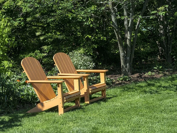 Pair of Adirondack chairs in a garden