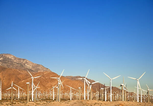 Palm Springs, CA, USA - Wind turbine farm in the desert under a clear blue sky. Horizontal